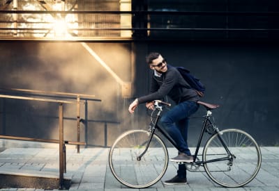 Resident biking to work near The Villages at Meyerland in Houston, Texas