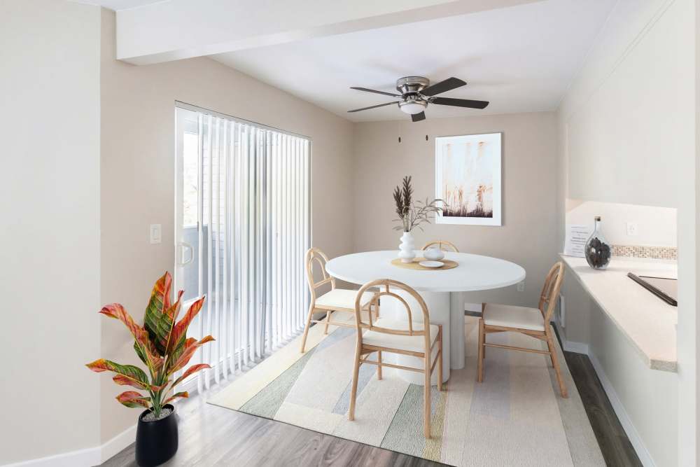 Bright dining areas with sliding glass door at Oswego Cove in Lake Oswego, Oregon