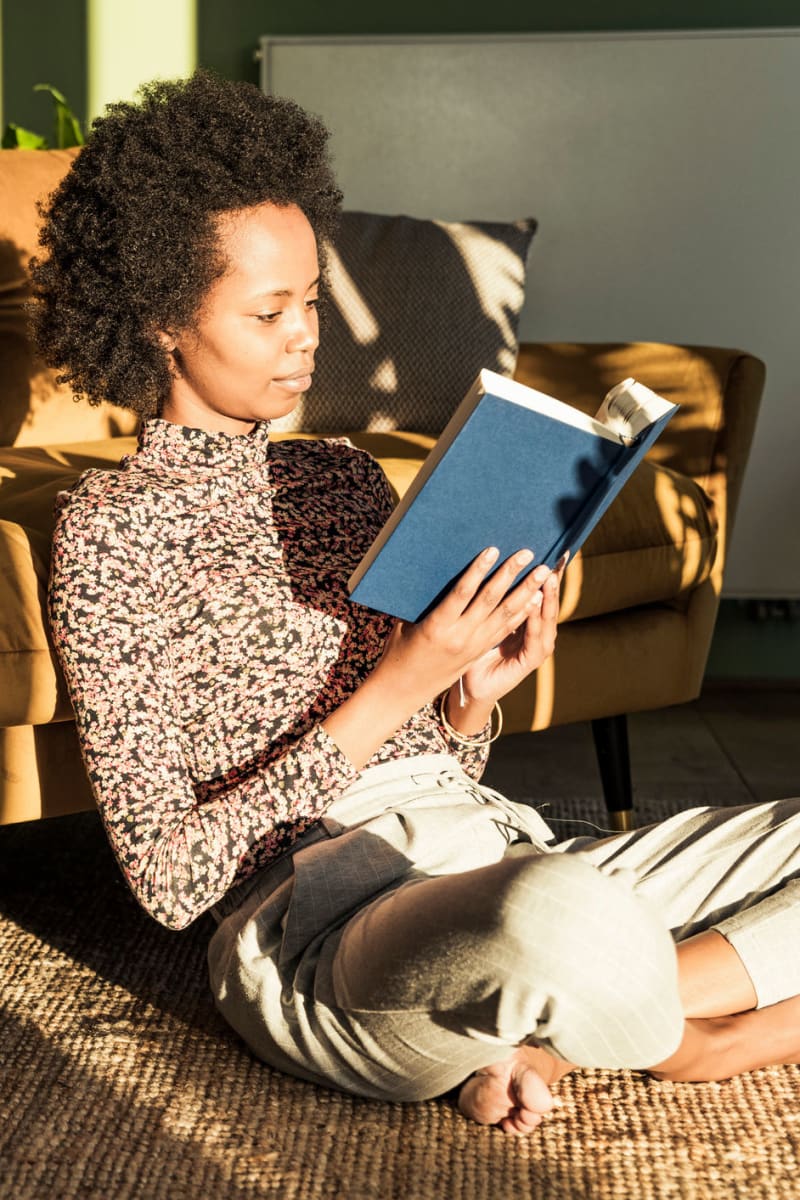 A woman reading at Optima Verdana® in Wilmette, Illinois