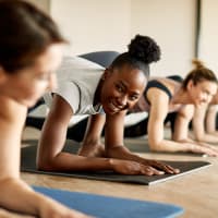 A group of women stretching in the fitness center at Evergreens at Mahan in Tallahassee, Florida