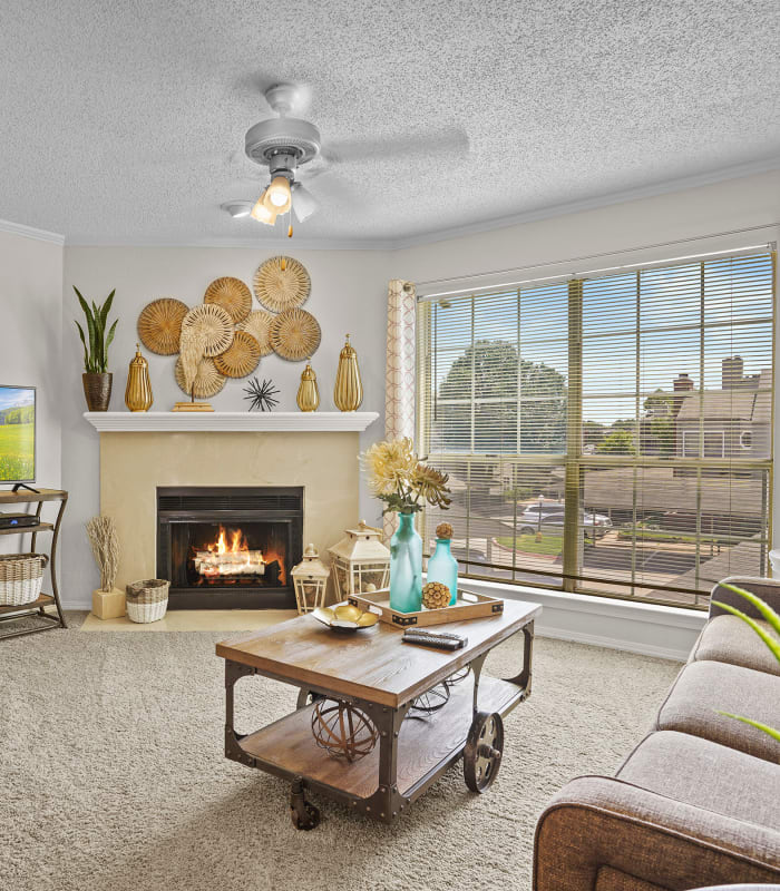 The Carpeted living room at Creekwood Apartments in Tulsa, Oklahoma