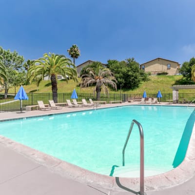 A resident relaxing in a swimming pool at South Mesa II in Oceanside, California