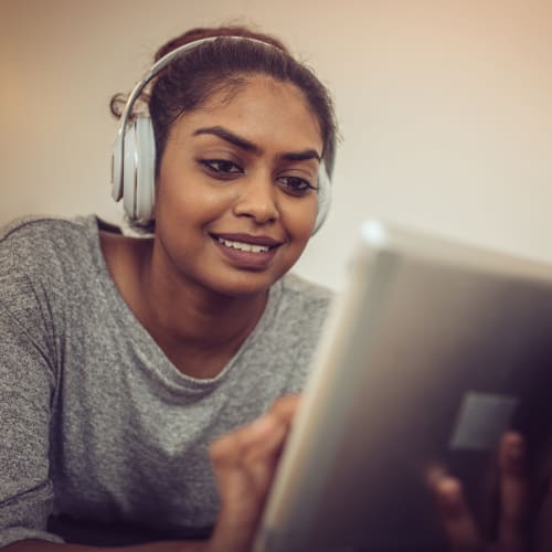 A resident listen on her music and reading at Miramar Milcon in San Diego, California