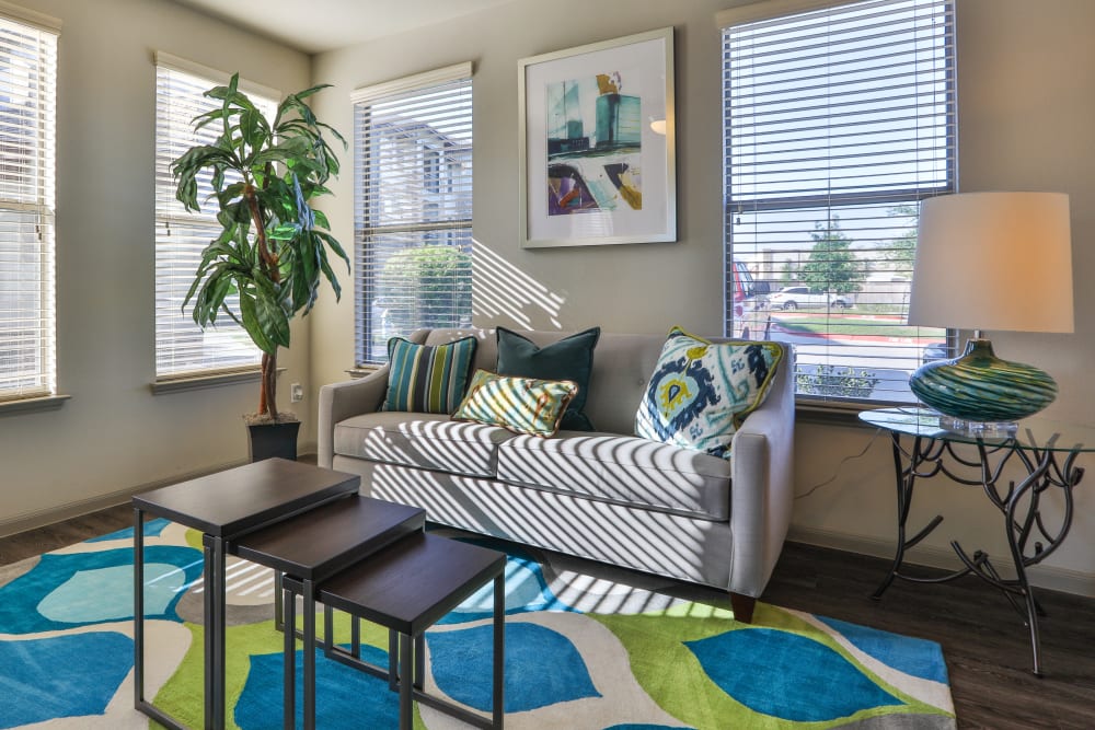 Well-furnished living space in a model home at Olympus at Waterside Estates in Richmond, Texas