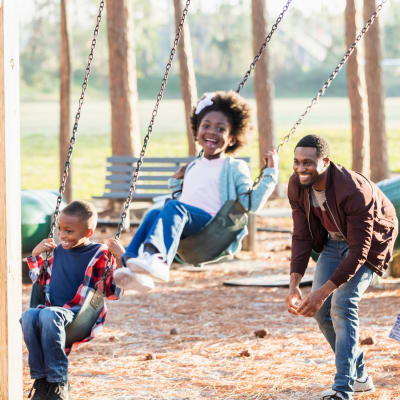 Residents and swingsets at a playground at Bayview Hills in San Diego, California