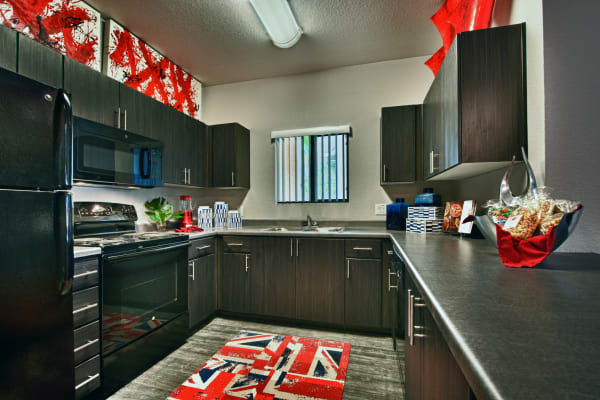 Modern kitchen with plenty of counter space at Avenue 25 Apartments in Phoenix, Arizona