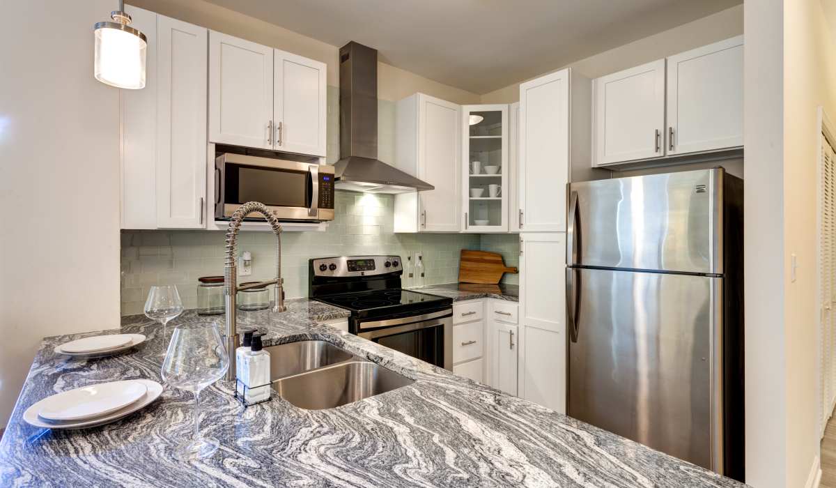 Kitchen with stainless-steel appliances and granite counter tops at East Beach Marina, Norfolk, Virginia