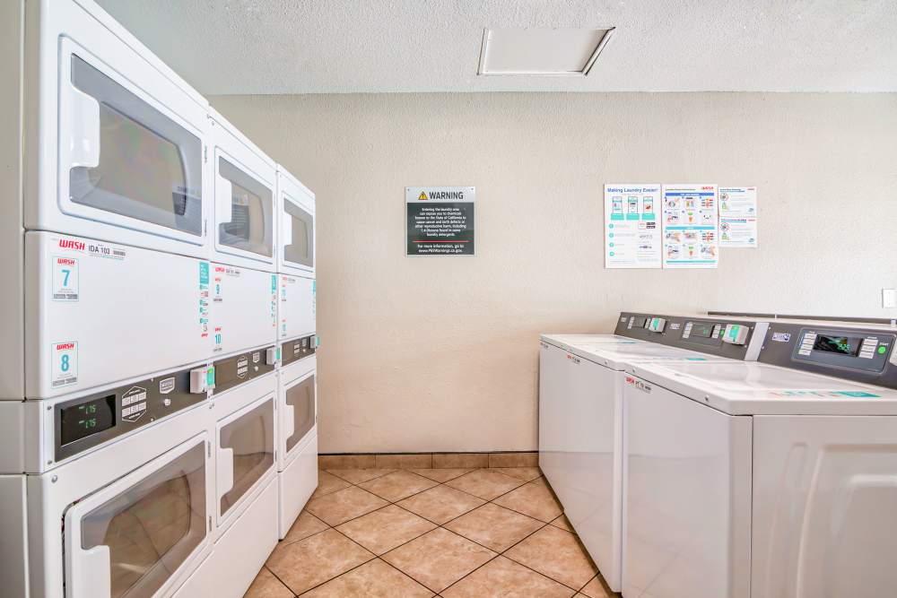 Laundry room at Strada Apartments in Orange, California