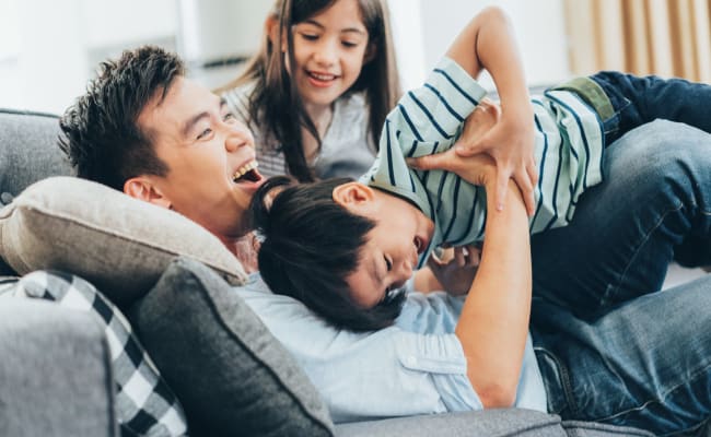 Family of three enjoying their life at Parkway Station Apartment Homes in Concord, North Carolina
