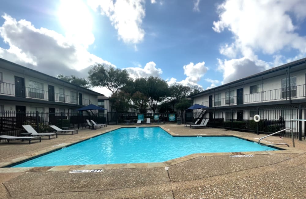 The sparkling community pool at Lovato Apartment Homes in Garland, Texas