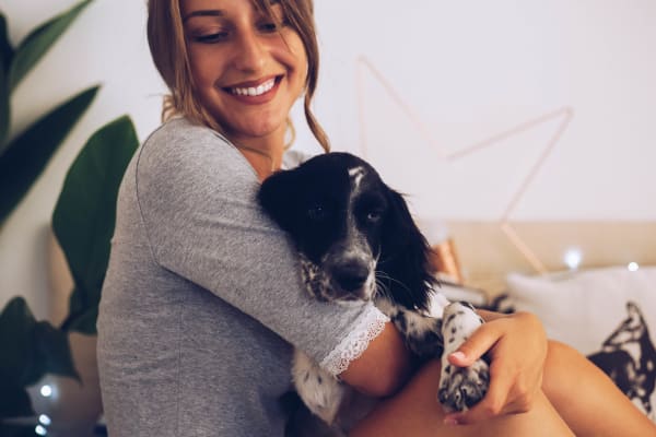 Girl with her cute puppy hanging out at Hudson on Farmer in Tempe, Arizona