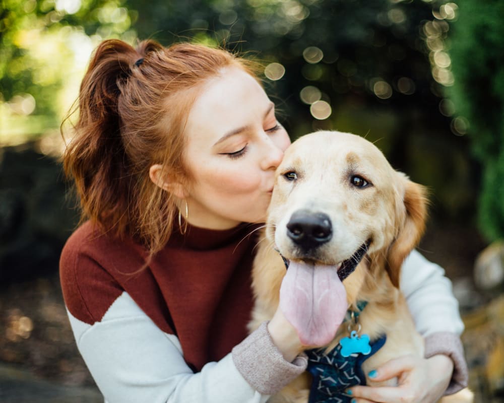 A resident loving on her dog at The Tessera in Phoenix, Arizona