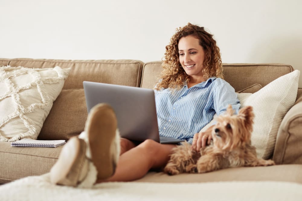 Resident working from home with some help from her dog at Starliter in Seattle, Washington