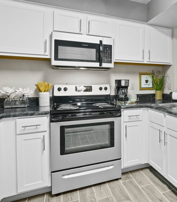Kitchen with granite countertops at Watercress Apartments in Maize, Kansas