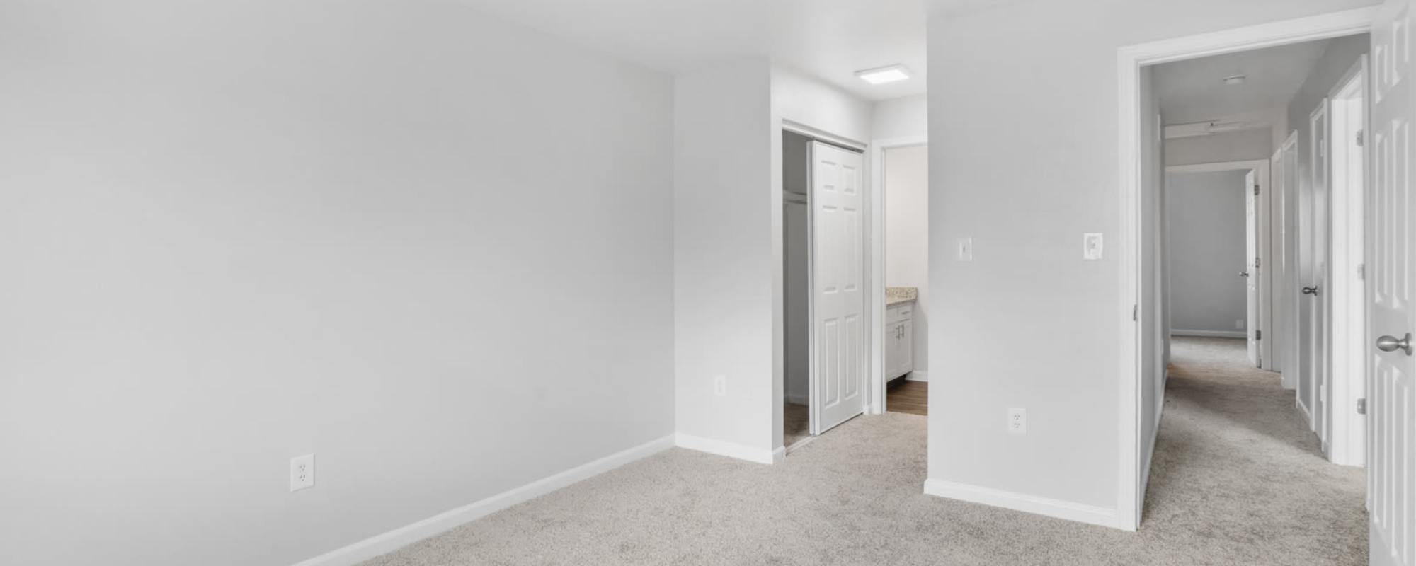 Bedroom with a closet and bathroom at an apartment at Eagle's Edge in Indianapolis 