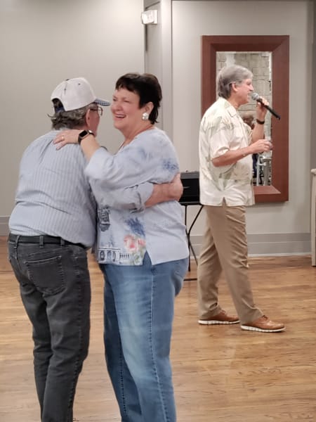A Dallas couple dances to the smooth singing of local musician Norris.