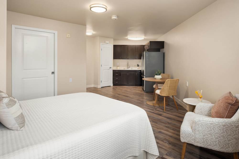 A staff member hugging a resident at Patriots Landing in DuPont, Washington. 