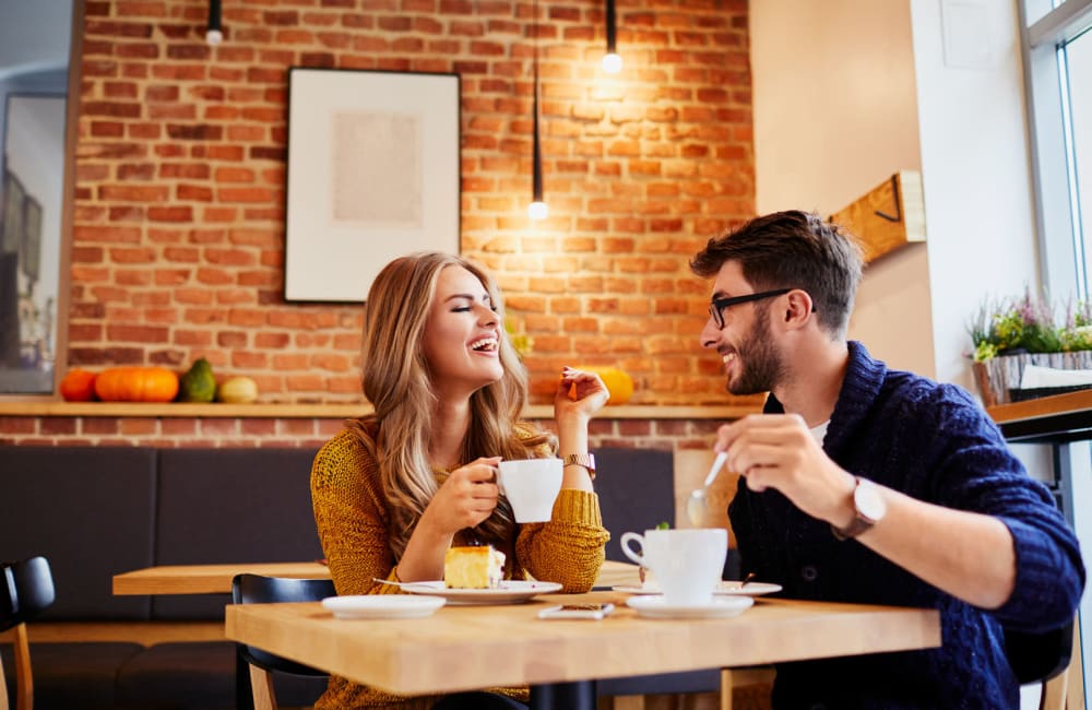 Happy couple eating near Curtis Johnson in Los Angeles, California