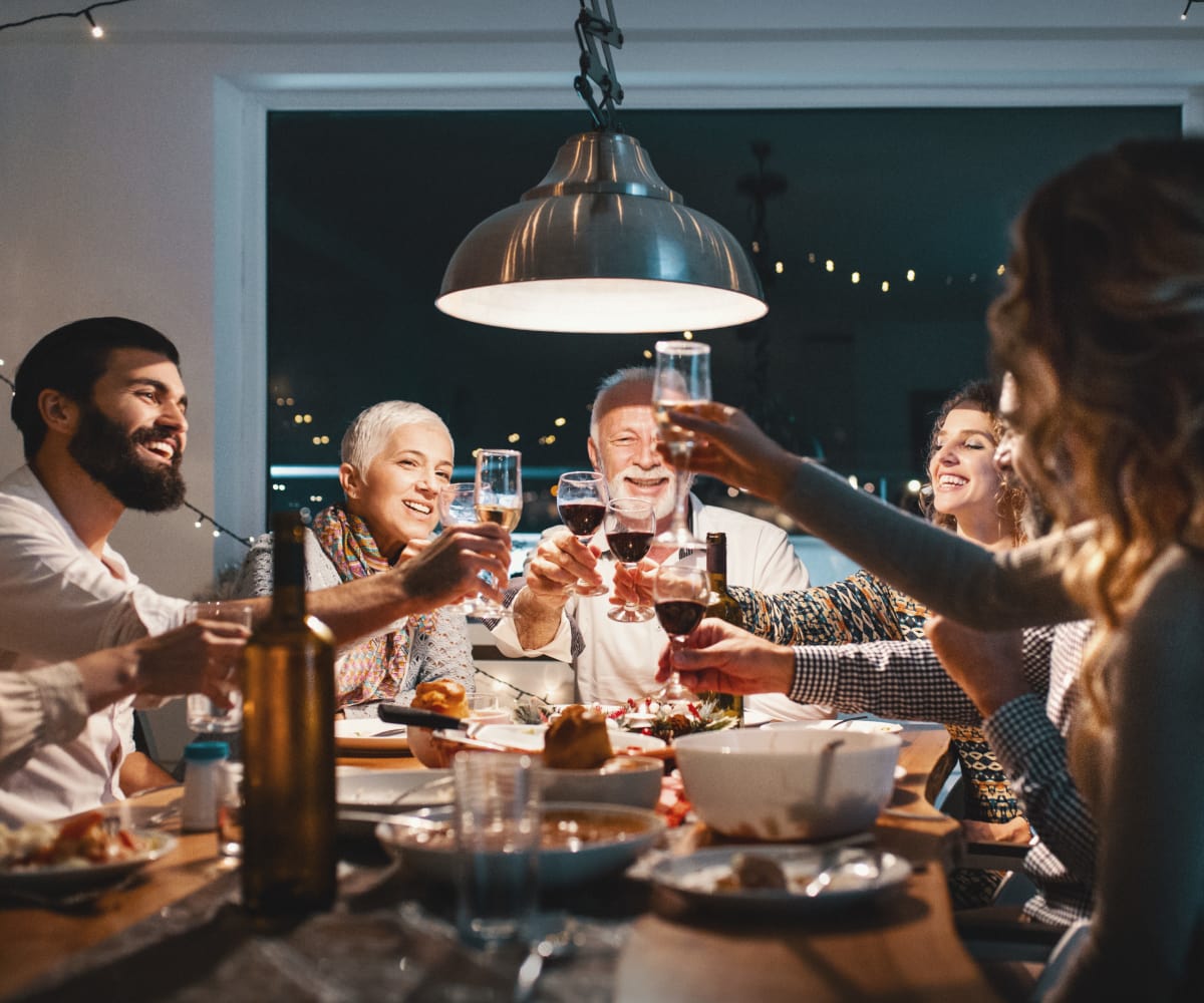 Friends enjoying dinner together at Scissortail Crossing Apartments in Broken Arrow, Oklahoma