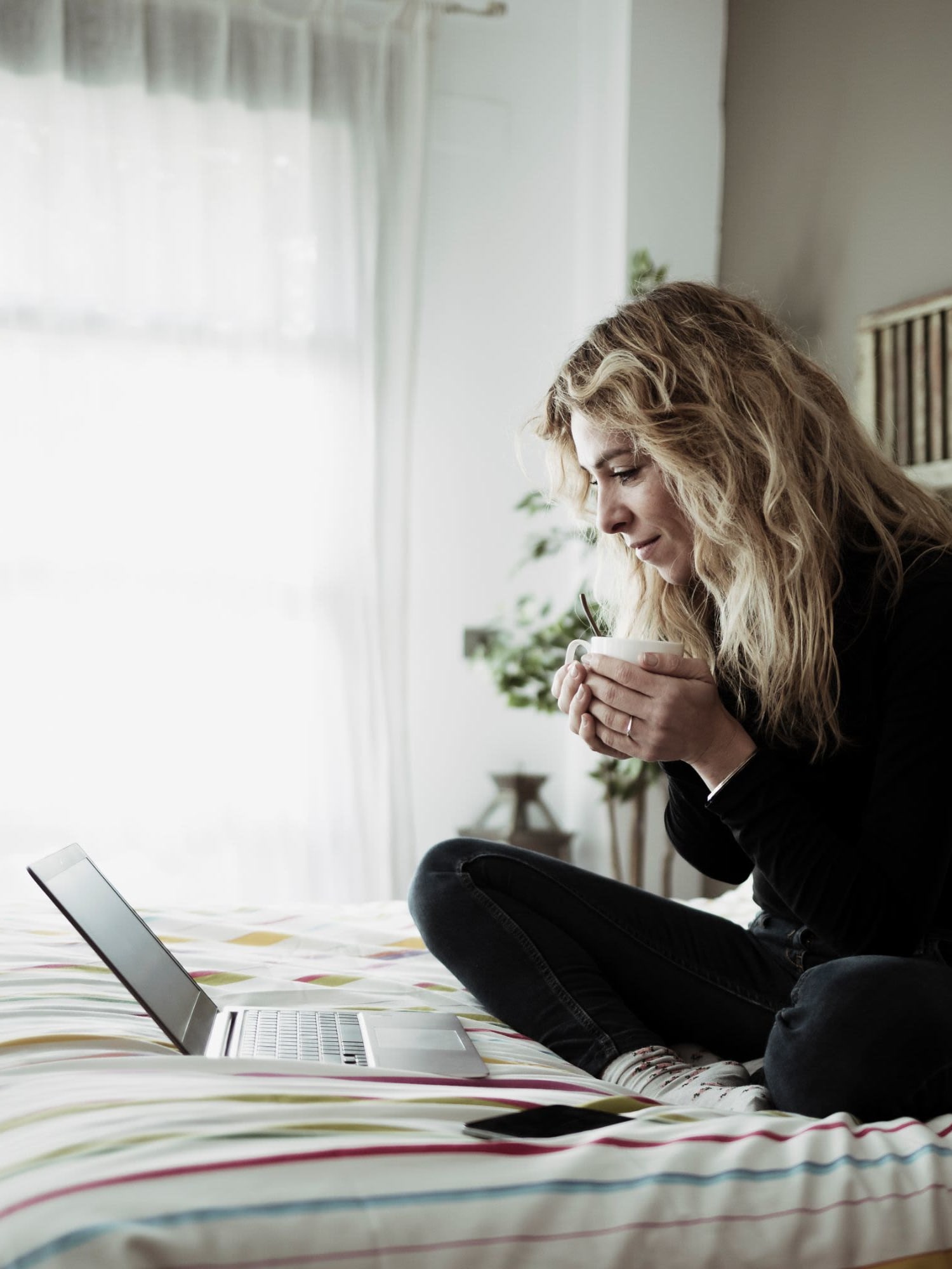 Resident working from home in her bedroom at Brixworth Apartments in Cincinnati, Ohio