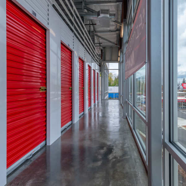 Indoor storage units with red doors at StorQuest Self Storage in Portland, Oregon