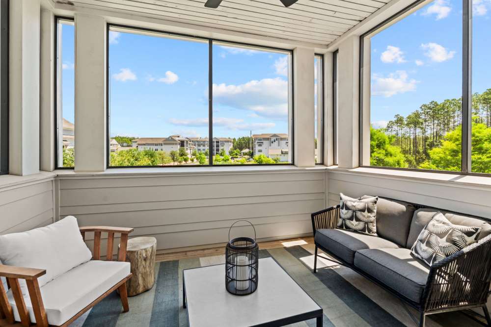 Private balcony with a door connecting to living room at Watersound Origins Crossings in Inlet Beach, Florida