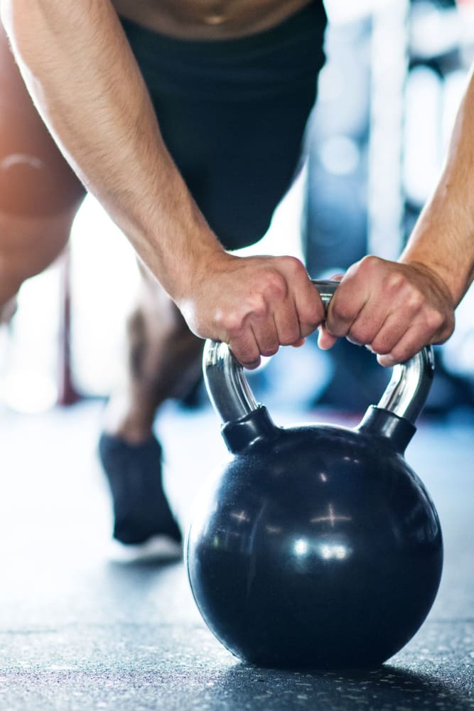 Resident in the fitness center at Kenneth Park Apartments in Carmichael, California