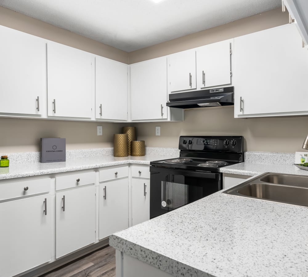 White cabinets in an apartment kitchen at Renaissance at Galleria in Hoover, Alabama