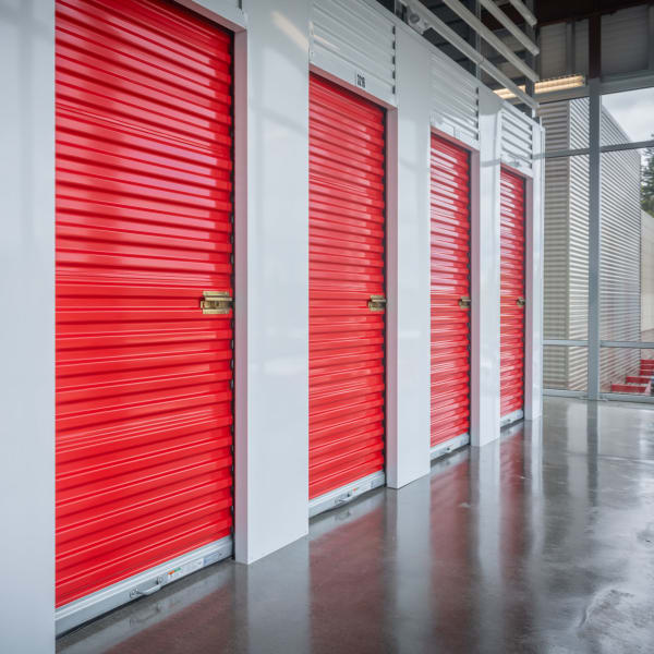 Red doors on indoor units at StorQuest Economy Self Storage in Hattiesburg, Mississippi