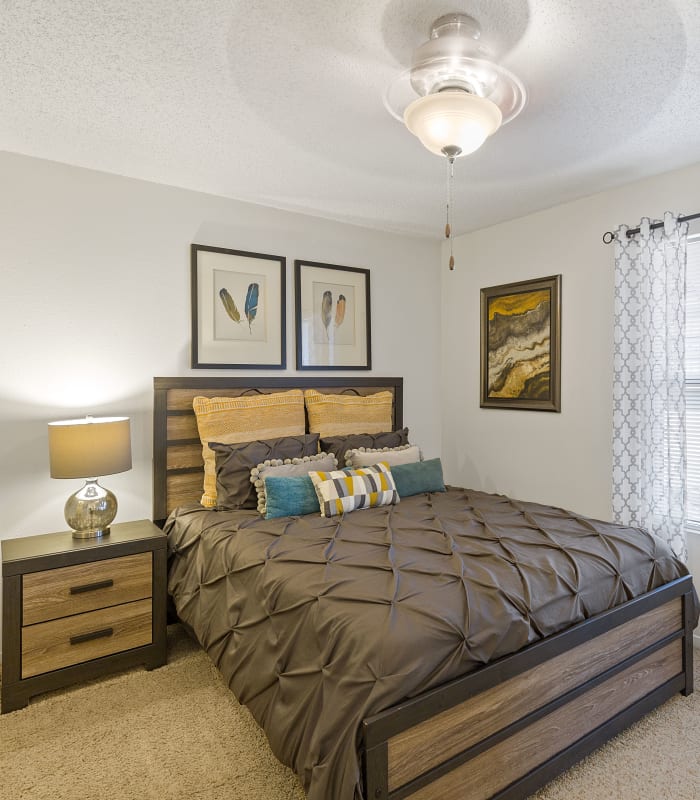 Spacious carpeted bedroom at Cimarron Trails Apartments in Norman, Oklahoma