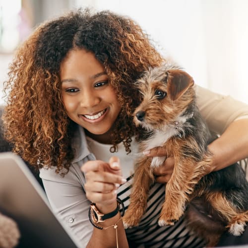 A resident holding her dog at Covenant Trace in Newport News, Virginia