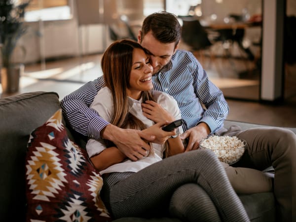 Residents cuddling in their luxury home at Vue West Apartment Homes in Denver, Colorado