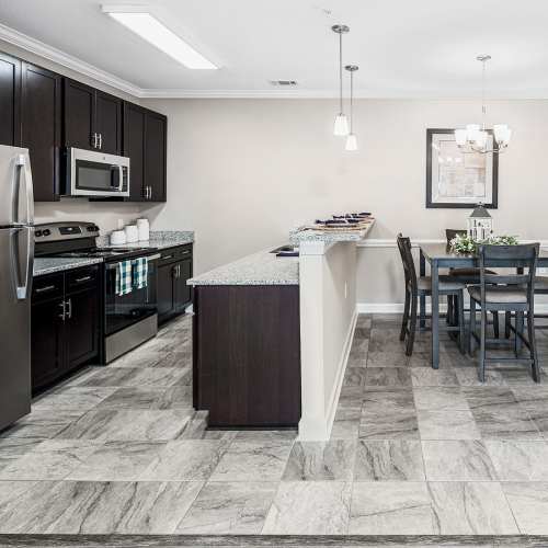 Kitchen with white cabinetry at Groves at Waters Edge in Waynesville, North Carolina
