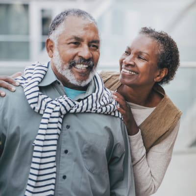 Happy independent living couple outside on a nice day at Cascade Park Adult Day Health in Tacoma, Washington