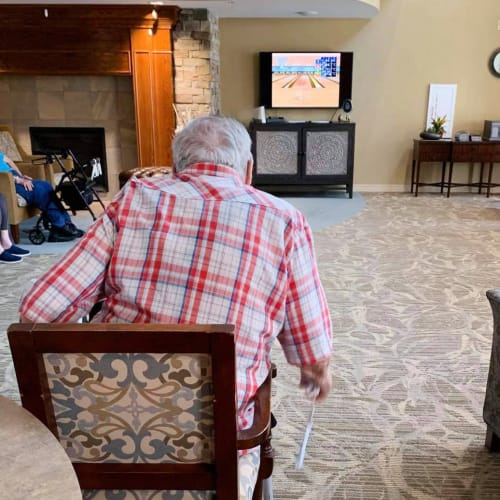 Resident playing wii at The Oxford Grand Assisted Living & Memory Care in Kansas City, Missouri