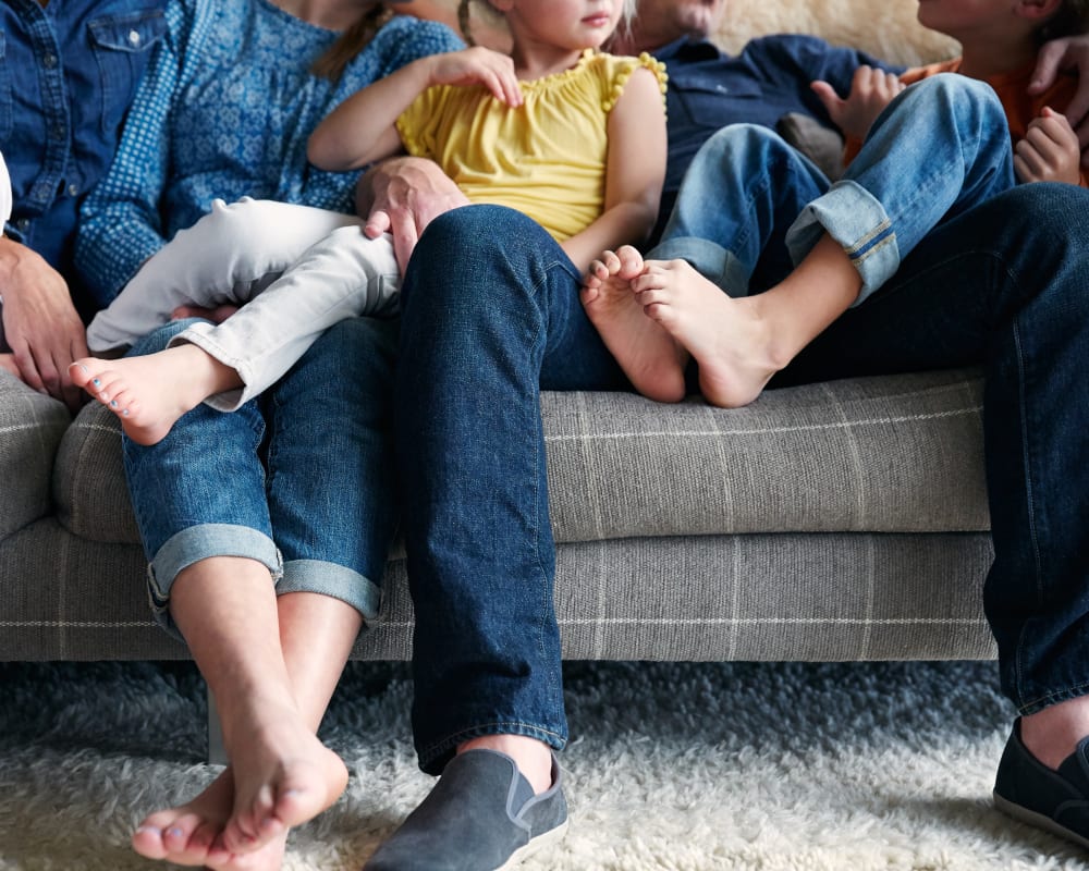 Family's happy feet in their new home at Sofi Berryessa in San Jose, California