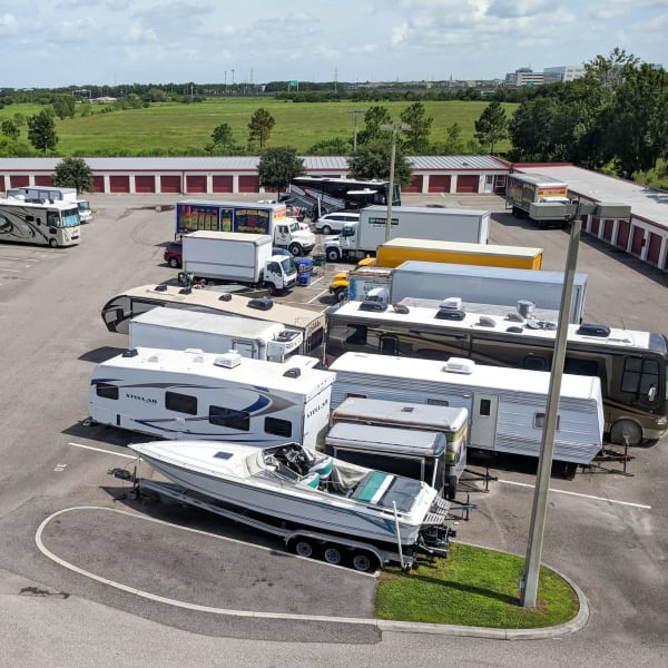RVs, boats, trucks, and trailers parked at StorQuest Self Storage in Sanford, Florida