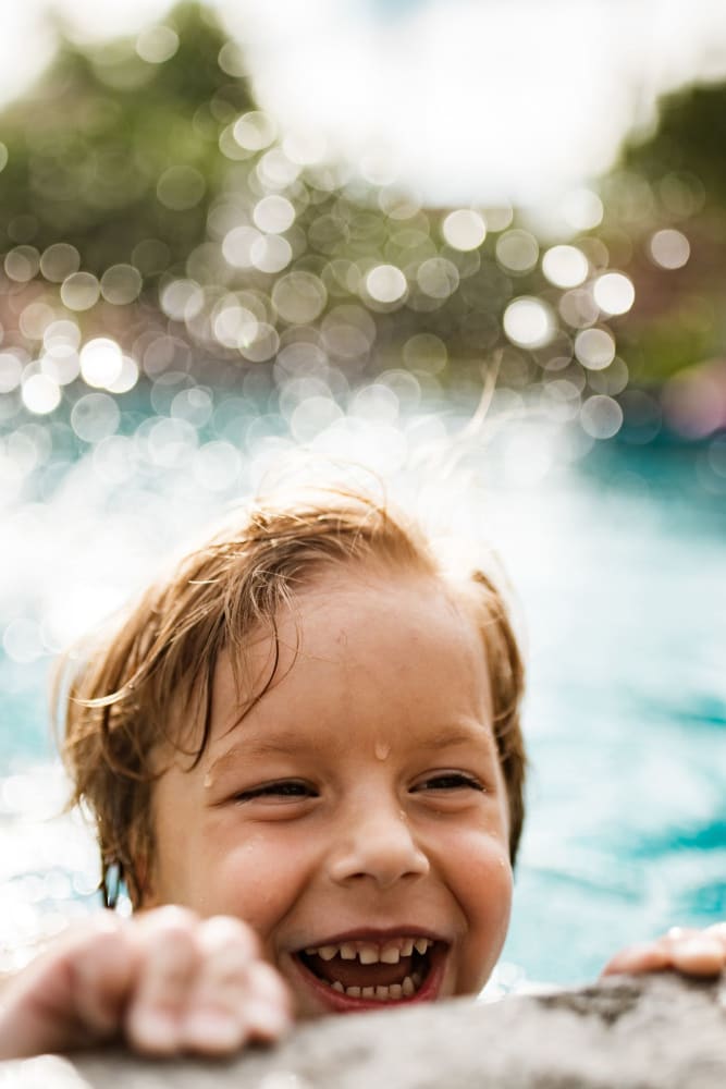 A kid splashing in the pool at Valley Terrace in Durham, North Carolina