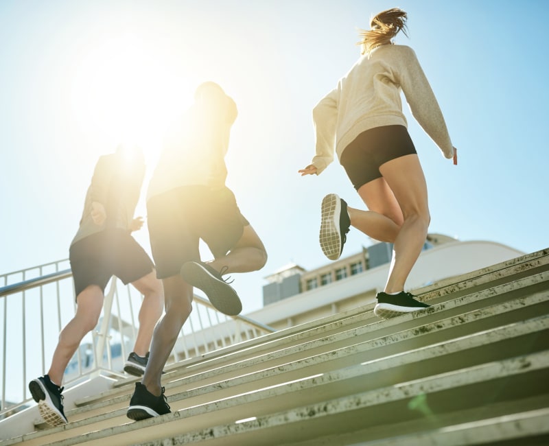 Residents running up the stairs outside at Prairie Shores in Chicago, Illinois