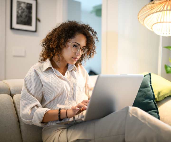 Resident working on her laptop at Trio Terraza in El Paso, Texas
