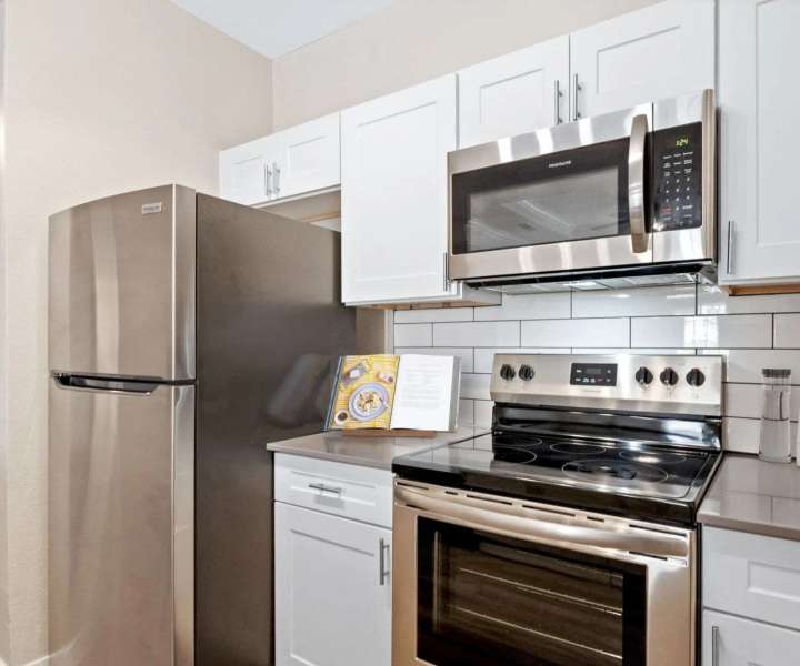 Kitchen with white cabinets at Reeves and Wells in Dallas, Texas