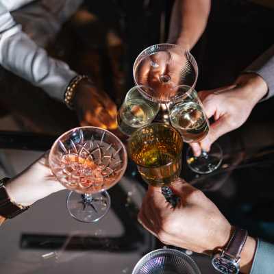 Residents toasting with drinks at Maple and Main Apartments in Downers Grove, IL