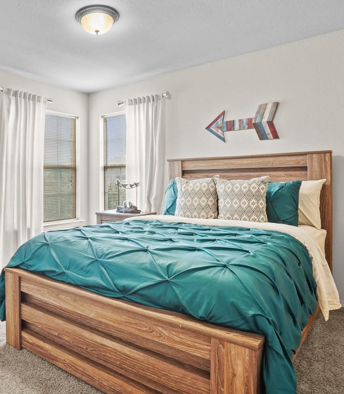 Spacious carpeted bedroom at Villas of Waterford Apartments in Wichita, Kansas