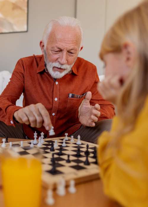 Two residents playing chess at Tuscan Gardens of Venetia Bay in Venice, Florida