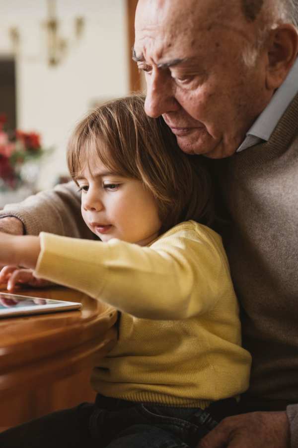 Resident spending time with their grandchild at Mission Ridge in Springfield, Missouri