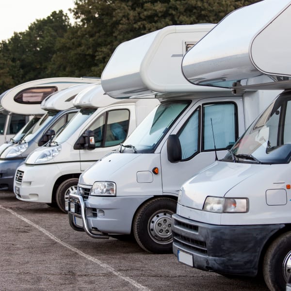 A row of RVs safely parked at StorageLand Rental Spaces in Arlington, Texas