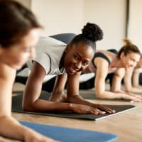 A group of women stretching in the fitness center at Lullwater at Blair Stone in Tallahassee, Florida