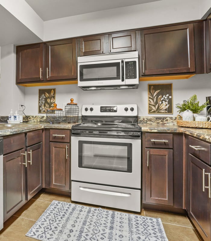 Kitchen with granite countertops at Mission Point Apartments in Moore, Oklahoma