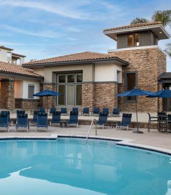 Pool and sundeck at Alize at Aliso Viejo Apartment Homes in Aliso Viejo, California