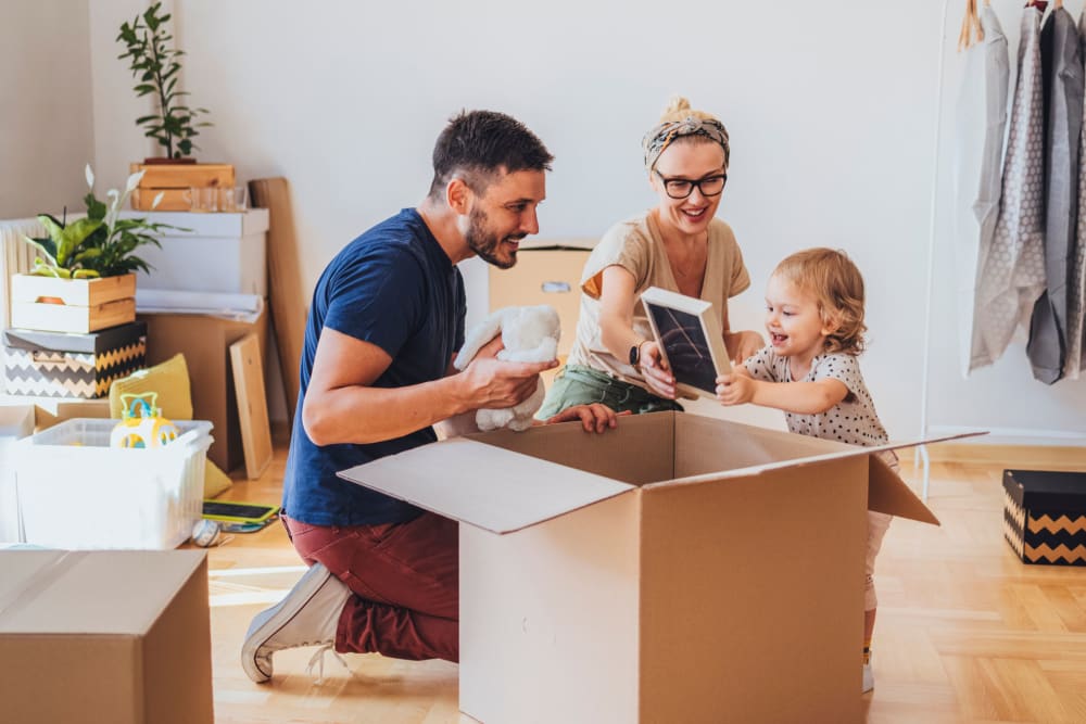 A family packing boxes for storage at Storage Star - Twin Falls South in Twin Falls, Idaho